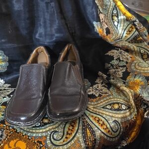 Brown leather loafer.